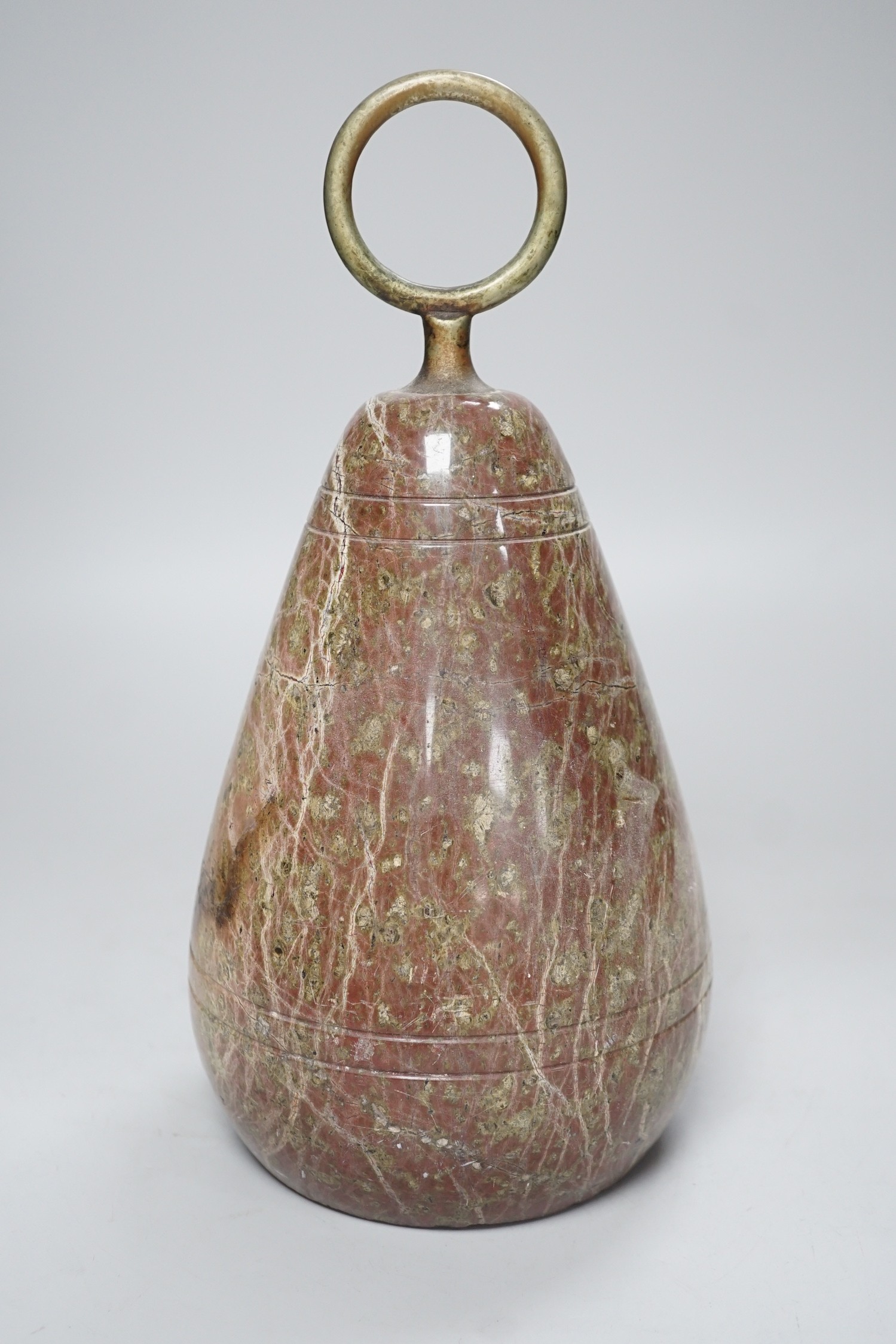 A polished serpentine doorstop. 21cm tall